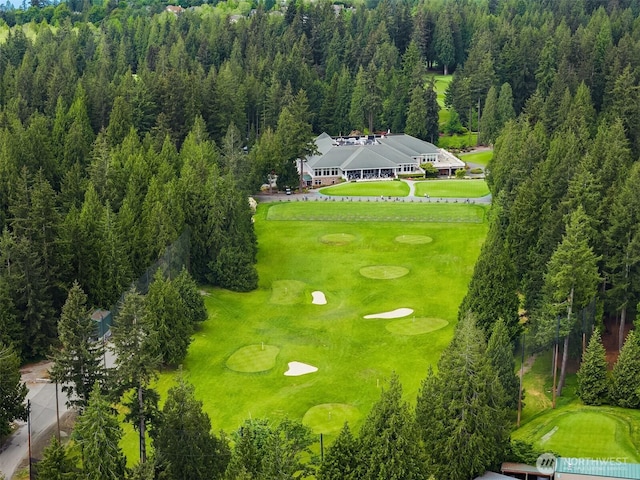 bird's eye view of a local golf course and a forest