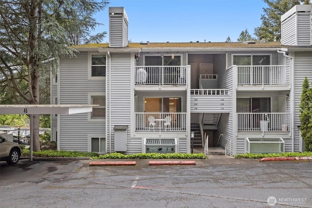 4106 Factoria Blvd SE Unit 216, Bellevue, WA 98006 - view of building exterior with uncovered parking