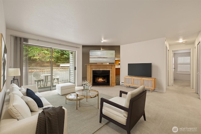 4106 Factoria Blvd SE Unit 216, Bellevue, WA 98006 - living room with light colored carpet and a fireplace