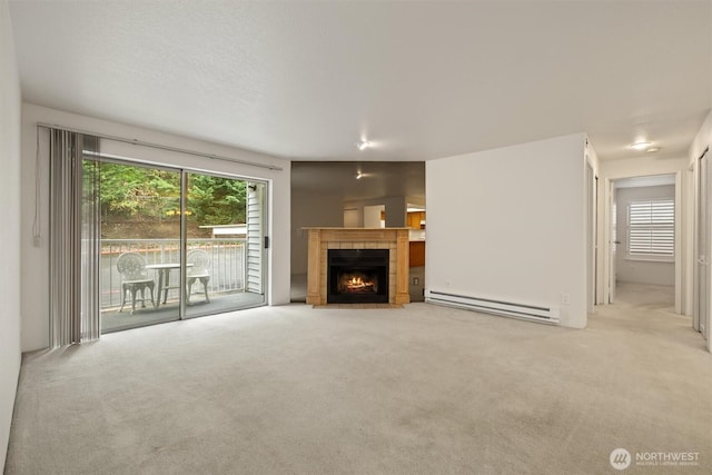 4106 Factoria Blvd SE Unit 216, Bellevue, WA 98006 - unfurnished living room featuring baseboard heating, carpet flooring, and a tile fireplace