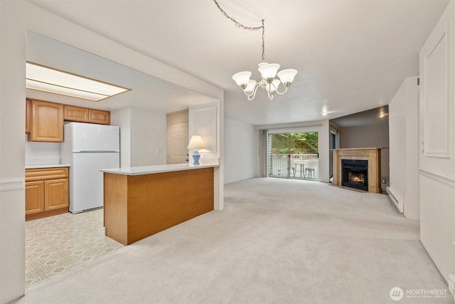 4106 Factoria Blvd SE Unit 216, Bellevue, WA 98006 - kitchen with freestanding refrigerator, open floor plan, a chandelier, light countertops, and light carpet