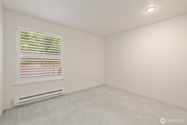 4106 Factoria Blvd SE Unit 216, Bellevue, WA 98006 - spare room featuring a baseboard radiator, carpet, and recessed lighting