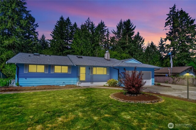 10910 114th Ave SW, Tacoma, WA 98498 - ranch-style home featuring an attached garage, concrete driveway, and a chimney