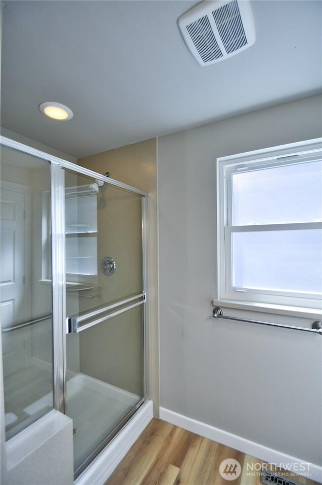 10910 114th Ave SW, Tacoma, WA 98498 - bathroom featuring a shower stall, wood finished floors, and baseboards