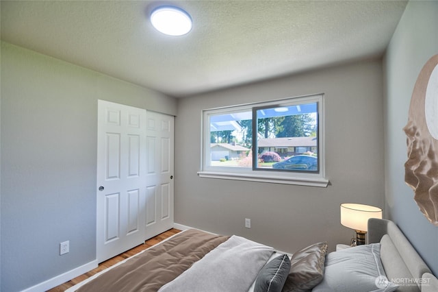 10910 114th Ave SW, Tacoma, WA 98498 - bedroom featuring wood finished floors and baseboards