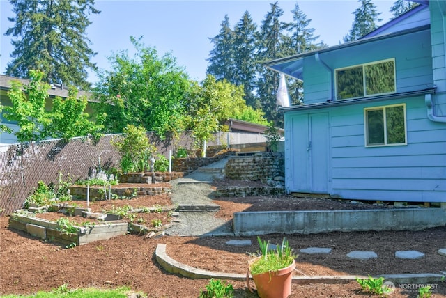10910 114th Ave SW, Tacoma, WA 98498 - fenced backyard featuring a garden