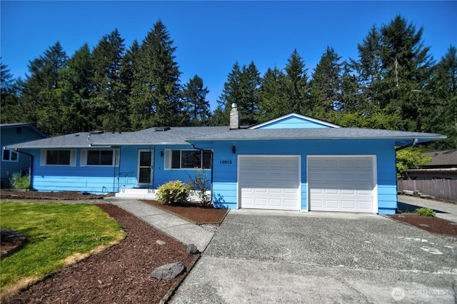 10910 114th Ave SW, Tacoma, WA 98498 - ranch-style house featuring an attached garage, concrete driveway, and a chimney