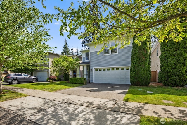 traditional home with asphalt driveway, a garage, and a front yard