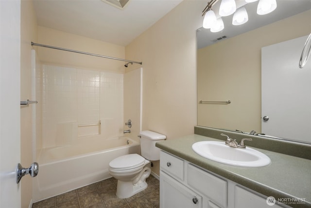 bathroom featuring toilet, vanity, shower / bathtub combination, and tile patterned floors