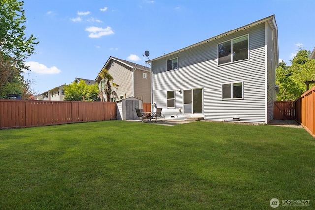 rear view of house with a storage unit, entry steps, an outdoor structure, and a patio area