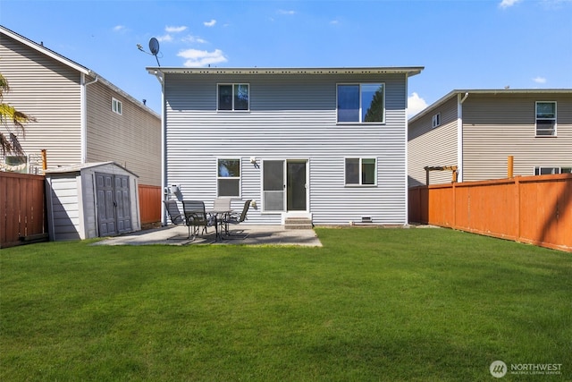 back of property with a storage shed, a patio area, and an outdoor structure