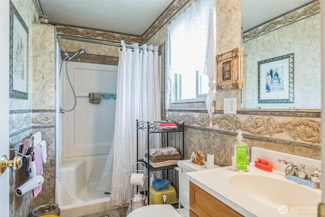 12623 Douglas Rd, Yakima, WA 98908 - full bathroom with a stall shower, wallpapered walls, vanity, and toilet