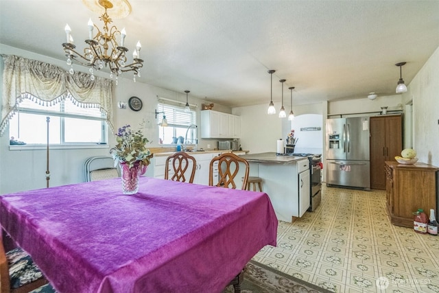12623 Douglas Rd, Yakima, WA 98908 - dining room featuring a chandelier and light flooring