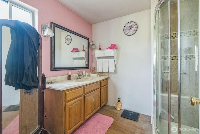 12623 Douglas Rd, Yakima, WA 98908 - full bath featuring wood finished floors, vanity, and a stall shower