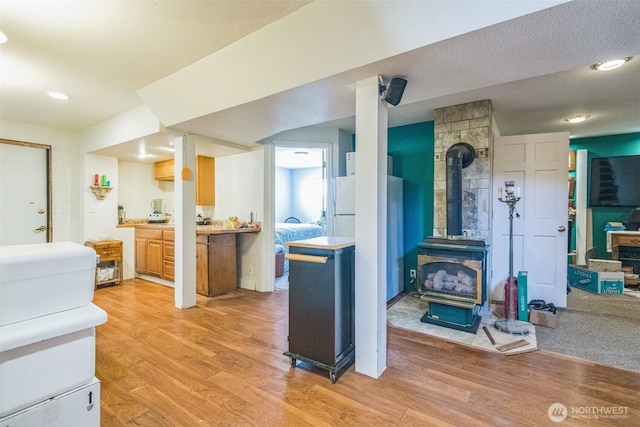 12623 Douglas Rd, Yakima, WA 98908 - kitchen with a wood stove, light wood-type flooring, and recessed lighting