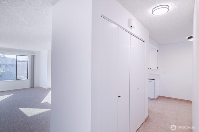 10713 Glen Acres Dr S, Seattle, WA 98168 - hall with a textured ceiling and baseboards