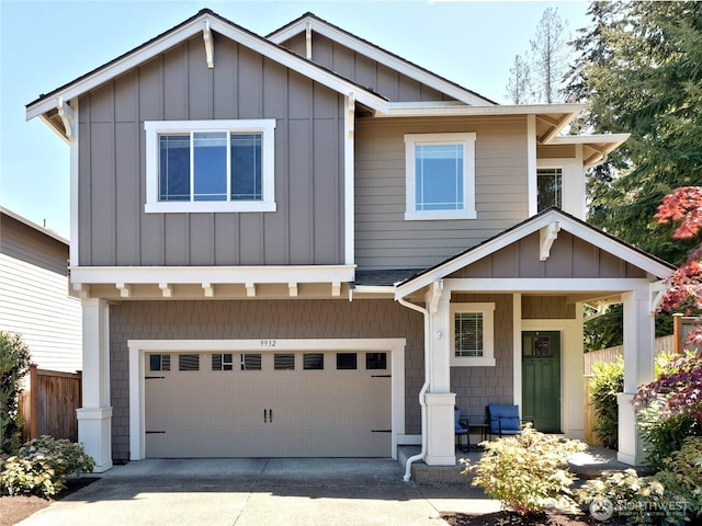 9932 15th Pl SE, Lake Stevens, WA 98258 - view of front facade featuring a garage, fence, concrete driveway, covered porch, and board and batten siding
