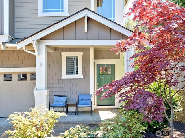9932 15th Pl SE, Lake Stevens, WA 98258 - property entrance with a porch, a garage, and board and batten siding