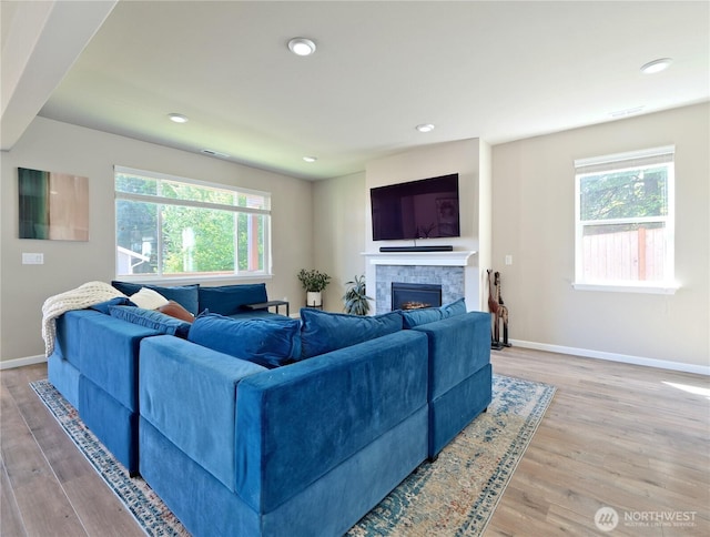 9932 15th Pl SE, Lake Stevens, WA 98258 - living area featuring healthy amount of natural light, wood finished floors, baseboards, and recessed lighting