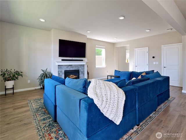 9932 15th Pl SE, Lake Stevens, WA 98258 - living area with baseboards, a glass covered fireplace, wood finished floors, and recessed lighting