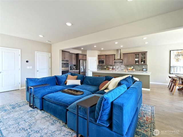 9932 15th Pl SE, Lake Stevens, WA 98258 - living area featuring light wood-style flooring, baseboards, and recessed lighting