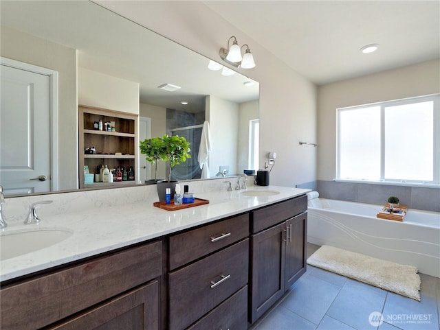 9932 15th Pl SE, Lake Stevens, WA 98258 - bathroom featuring tile patterned floors, a stall shower, a bath, and double vanity