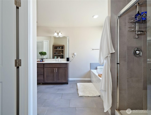 9932 15th Pl SE, Lake Stevens, WA 98258 - full bath featuring a shower stall, vanity, tile patterned floors, a garden tub, and baseboards