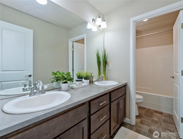 9932 15th Pl SE, Lake Stevens, WA 98258 - bathroom with double vanity, toilet, and bathing tub / shower combination