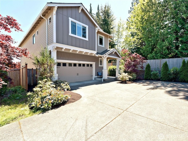 9932 15th Pl SE, Lake Stevens, WA 98258 - view of front of home with board and batten siding, fence, a garage, and driveway