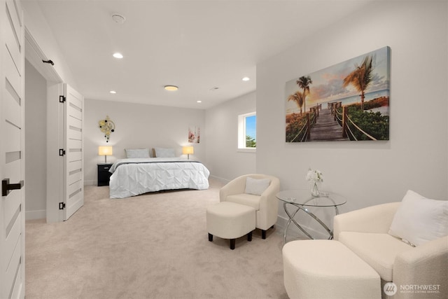 bedroom with light colored carpet, recessed lighting, and baseboards