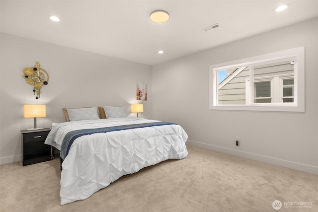 carpeted bedroom featuring baseboards and recessed lighting