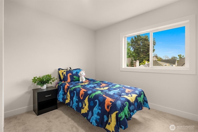 carpeted bedroom with baseboards