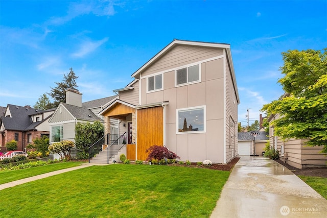 view of front of house featuring a front yard, a garage, and board and batten siding
