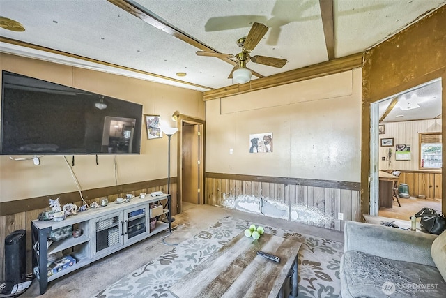 510 Duterrow Rd SE Unit 37, Olympia, WA 98513 - living area featuring wood walls, wainscoting, and a ceiling fan
