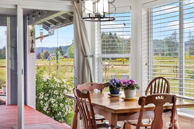 48 Bennett Ln, Oakville, WA 98568 - dining space featuring a chandelier, plenty of natural light, and a mountain view