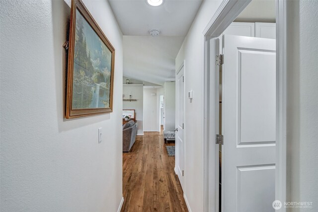 48 Bennett Ln, Oakville, WA 98568 - hall with dark wood-style flooring and lofted ceiling