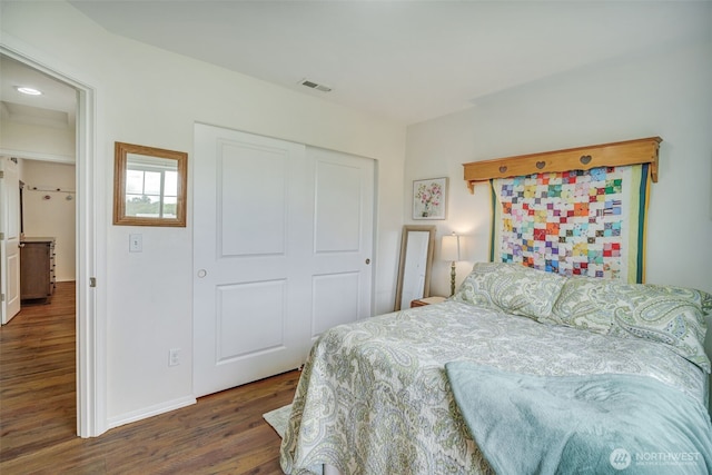 48 Bennett Ln, Oakville, WA 98568 - bedroom featuring wood finished floors, a closet, and baseboards
