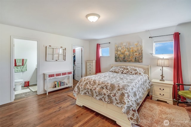 48 Bennett Ln, Oakville, WA 98568 - bedroom with multiple windows, wood finished floors, a spacious closet, and ensuite bathroom