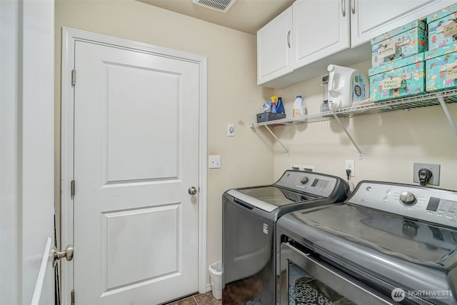 48 Bennett Ln, Oakville, WA 98568 - washroom featuring washing machine and clothes dryer and cabinet space