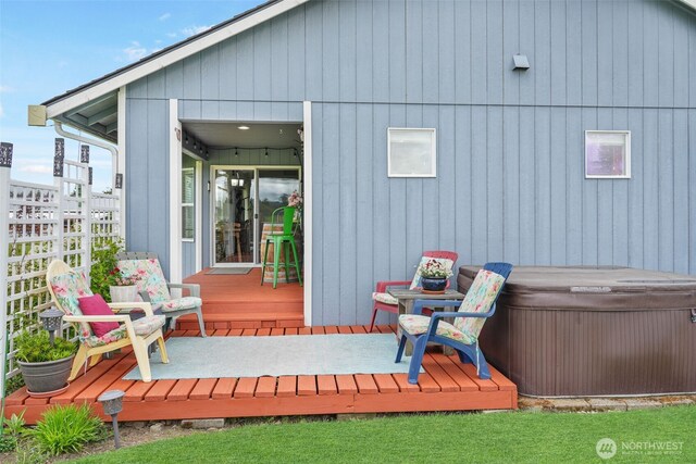 48 Bennett Ln, Oakville, WA 98568 - back of property featuring a hot tub and a wooden deck
