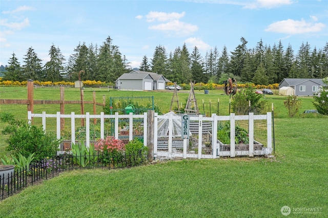 48 Bennett Ln, Oakville, WA 98568 - view of yard with a garden and a detached garage