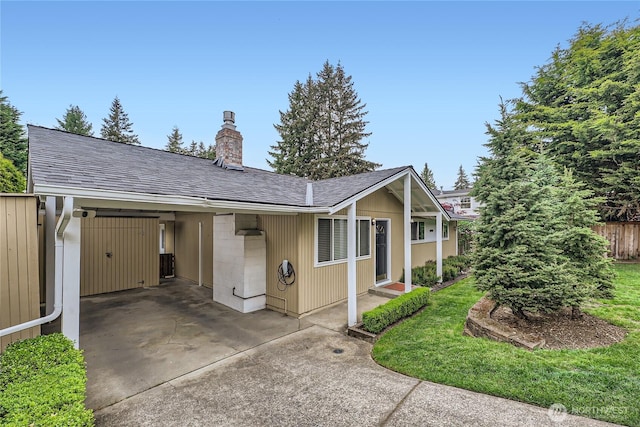 single story home featuring a chimney, roof with shingles, and fence