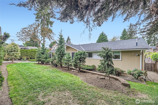 view of property exterior featuring a shingled roof