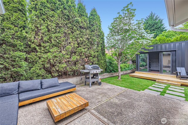 view of patio / terrace with an outdoor hangout area, grilling area, and a wooden deck