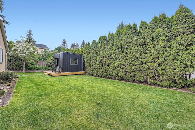 view of yard featuring a wooden deck