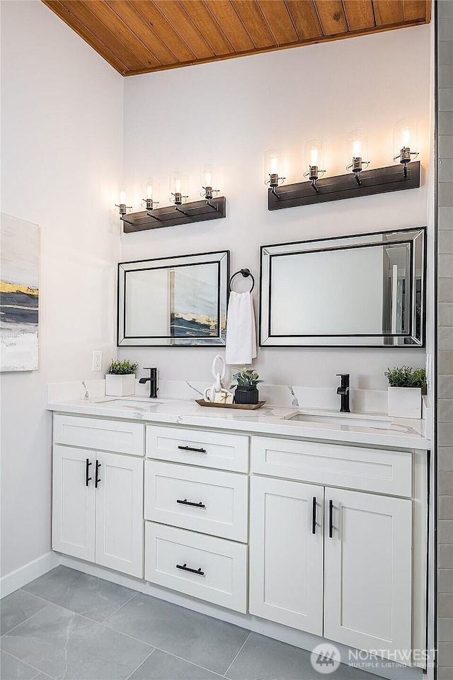 900 Sea Vista Pl, Edmonds, WA 98020 - bathroom with wood ceiling, baseboards, double vanity, and marble finish floors
