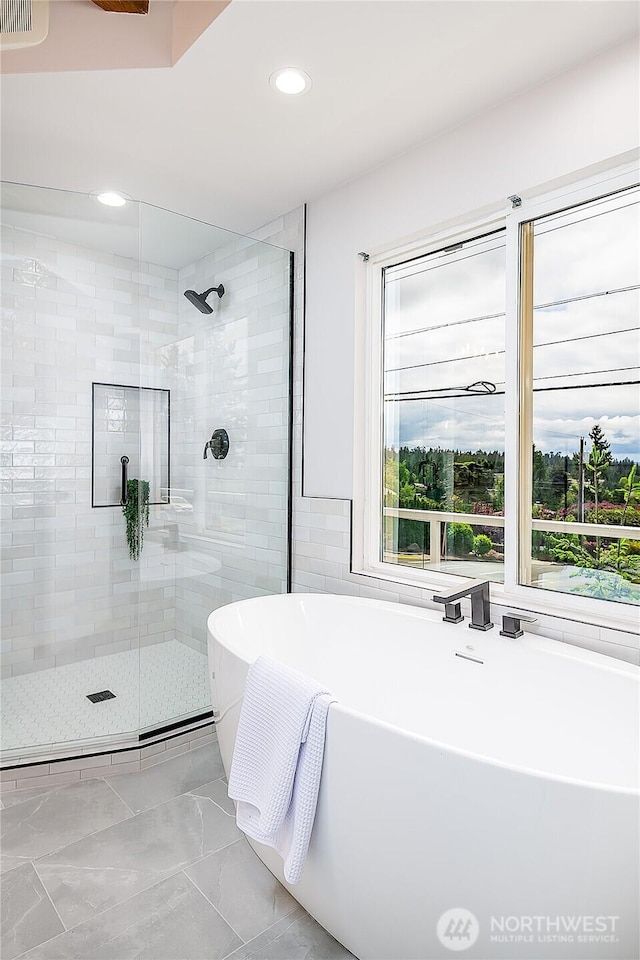 900 Sea Vista Pl, Edmonds, WA 98020 - full bathroom featuring a stall shower, a freestanding bath, recessed lighting, and marble finish floors
