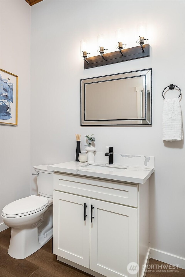 900 Sea Vista Pl, Edmonds, WA 98020 - bathroom with toilet, wood finished floors, vanity, and baseboards