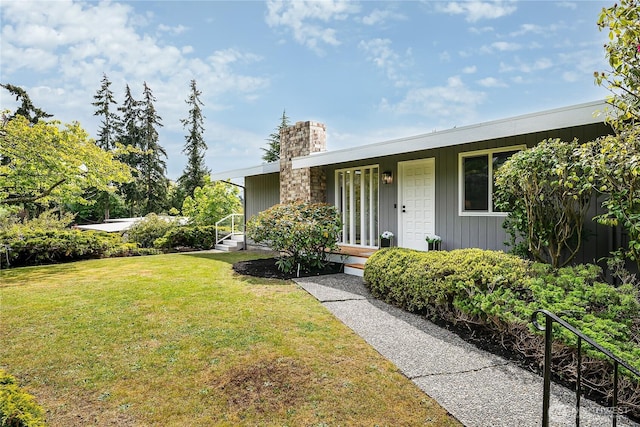900 Sea Vista Pl, Edmonds, WA 98020 - view of front facade with a front yard, a chimney, and covered porch