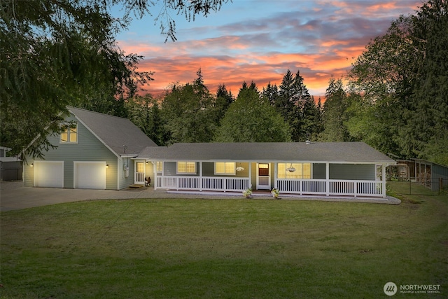 13520 Burn Rd, Arlington, WA 98223 - view of front of house featuring covered porch, a lawn, and concrete driveway